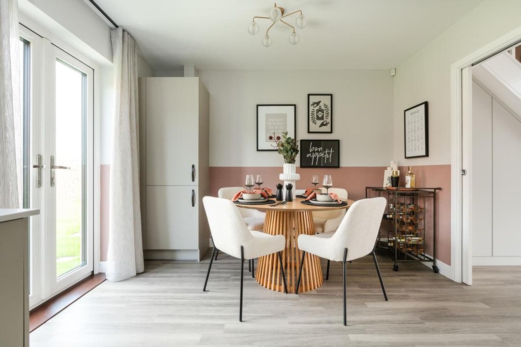 The kitchen/dining area features double doors...