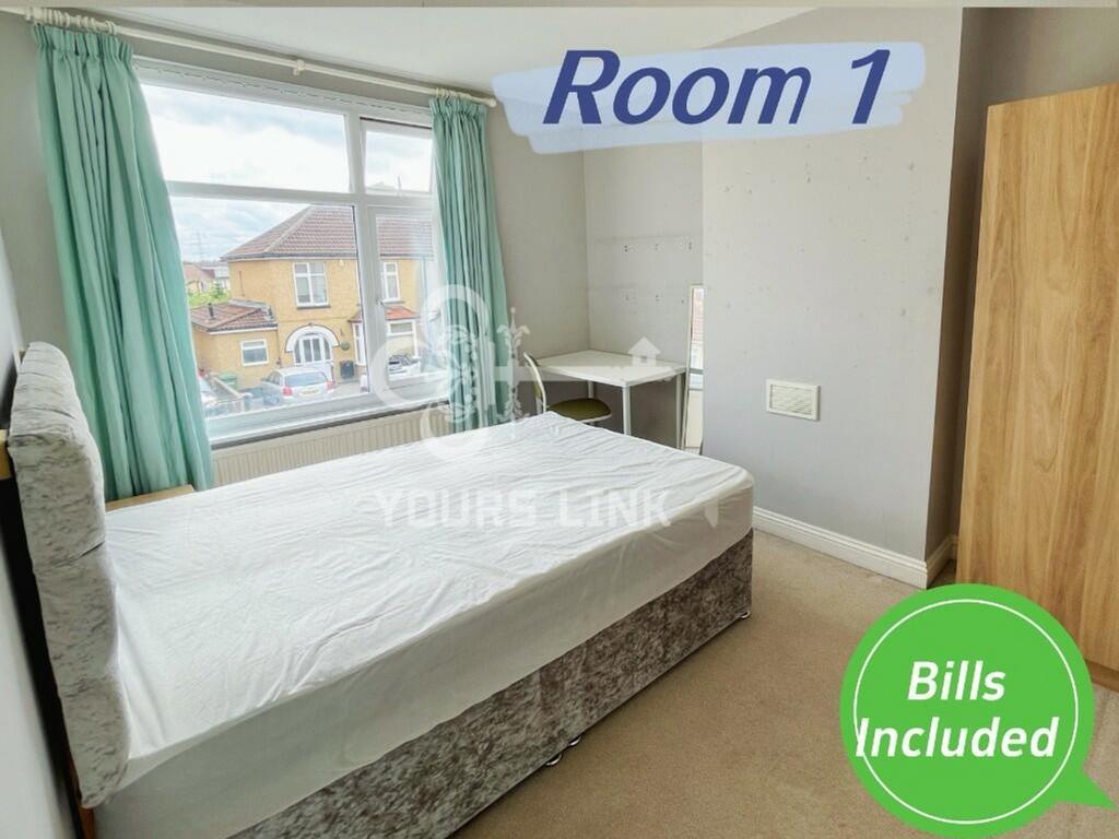 A bright and spacious double bedroom with natur...