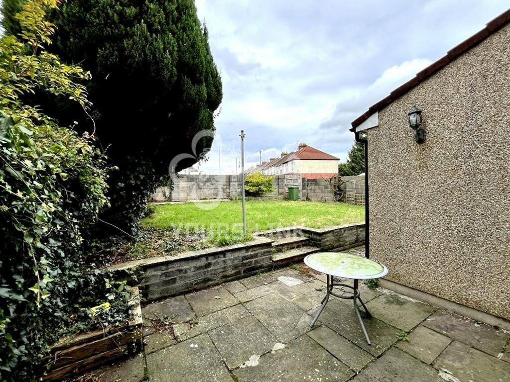 A spacious and well-maintained garden area, per...