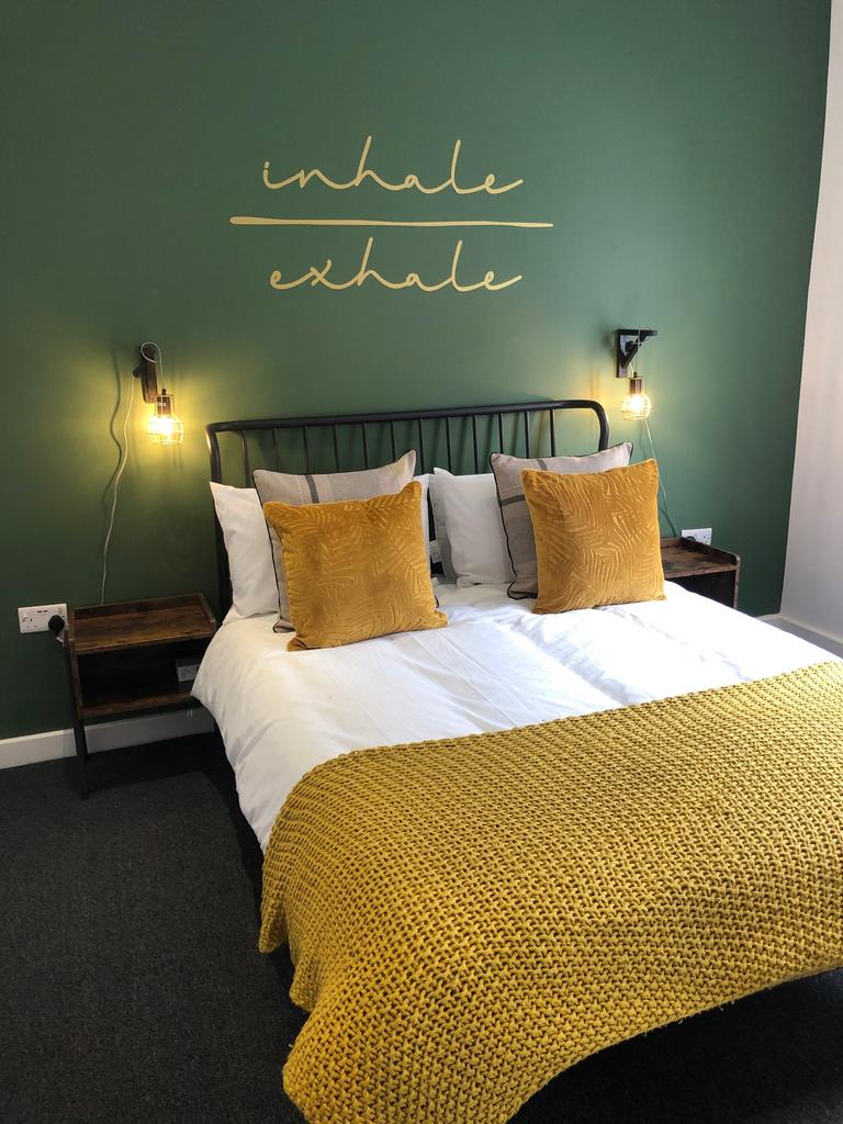 A bright and spacious double bedroom with natur...