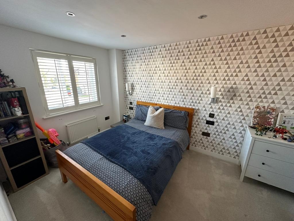 A spacious and stylish large double bedroom wit...