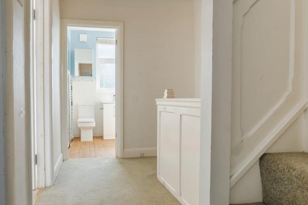 A bright and tidy hallway that welcomes you int...