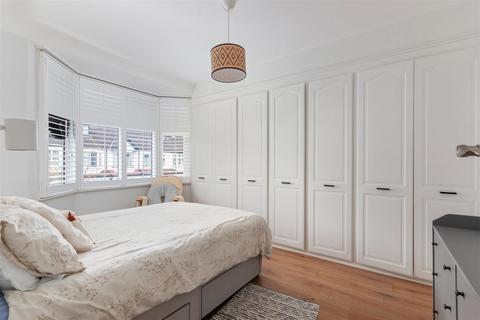 18 Abbott Avenue, London, SW20 8SQ