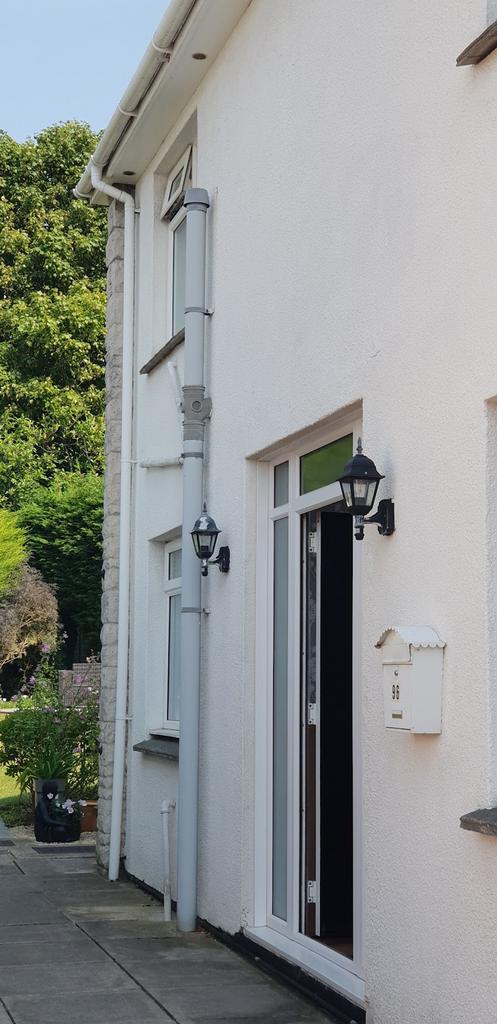 A welcoming entrance to a property with a well ...