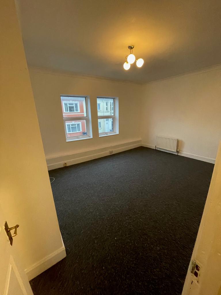 A spacious and bright living room, perfect for ...