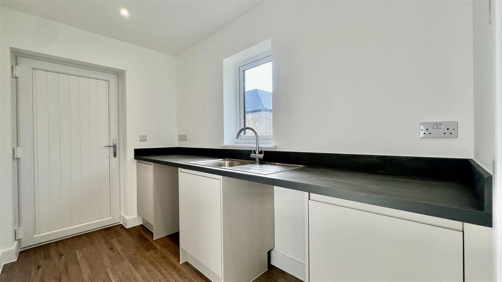 Utility with space for a washing machine and tumbl