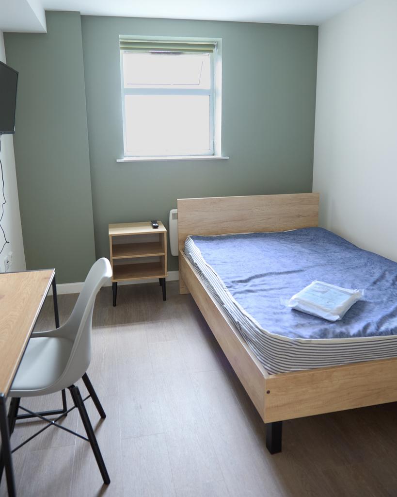 A bright and inviting double bedroom featuring ...