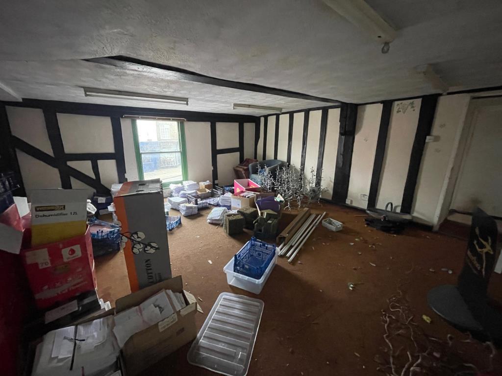 Another vacant first floor room with window to fro