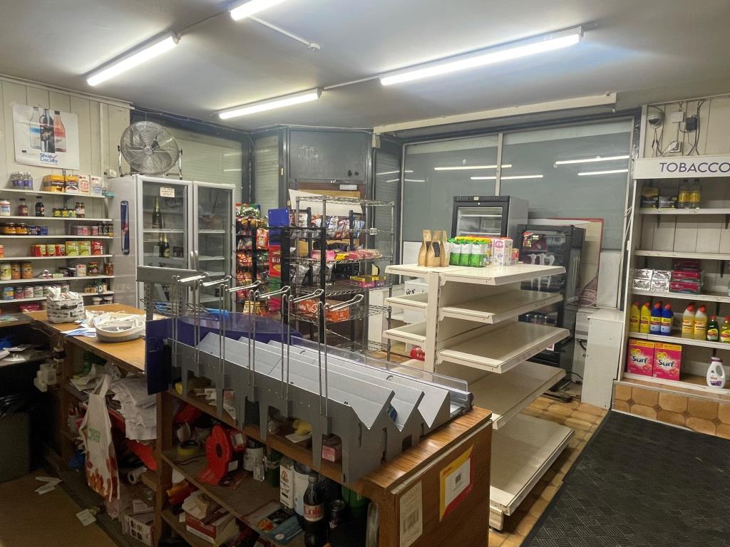 Shop floor with shelving and counter area from alt