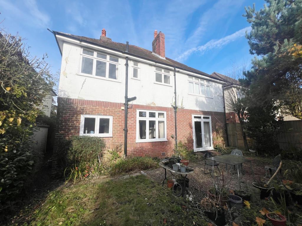 Rear elevation of house with back garden