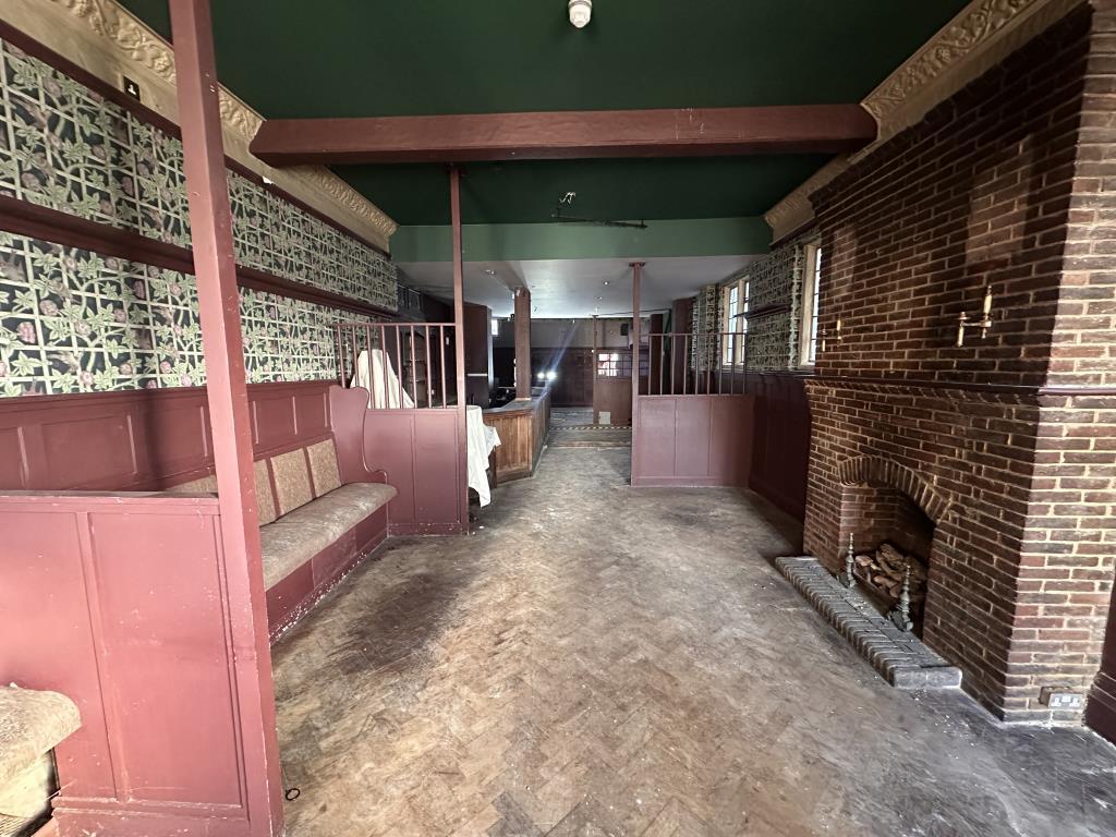 Main bar area with parquet floor and bench seats