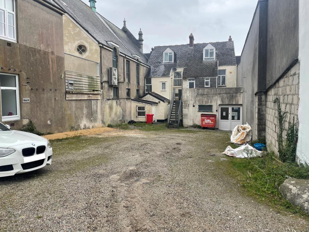 Rear car park with property in background