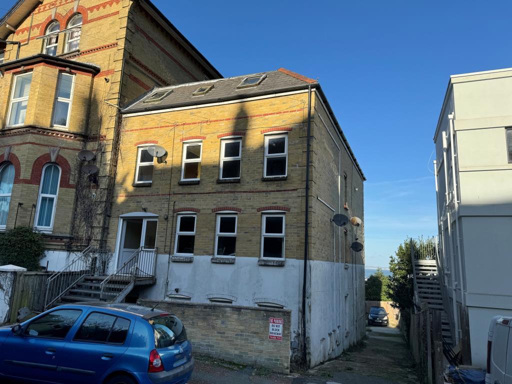 Freehold block of flats with painted render to low