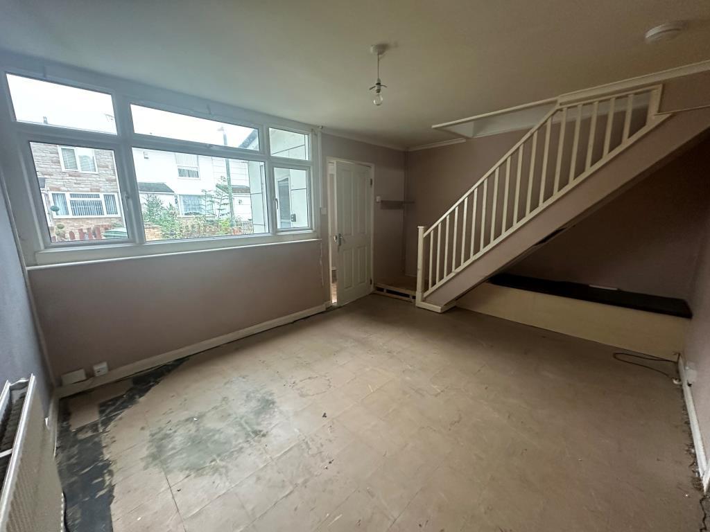 Living room at house of house needing refurbishmen