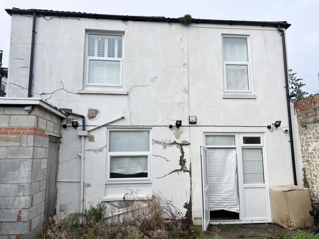 Rear elevation with painted render and windows