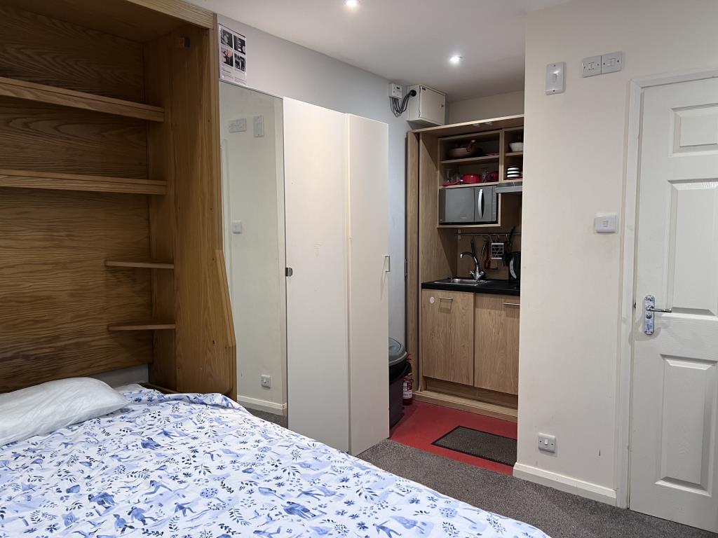 Studio room showing bed and kitchenette