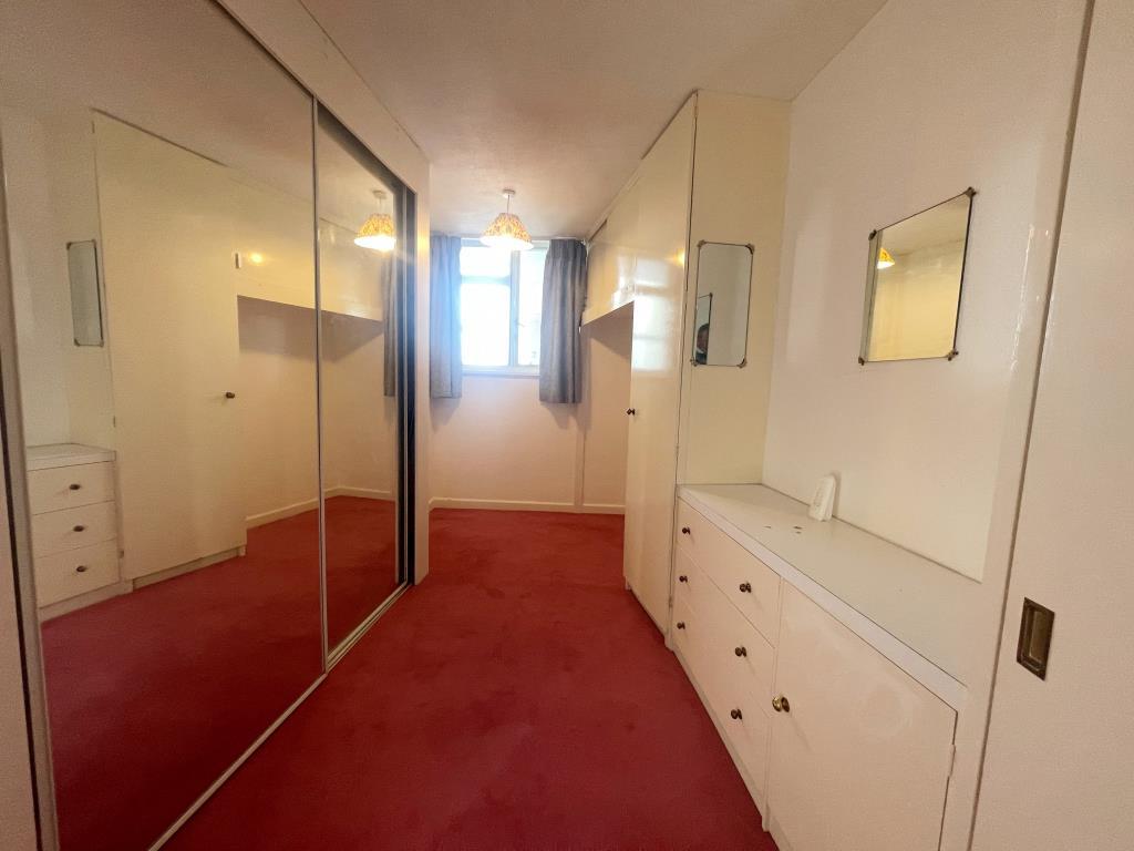 Second bedroom with fitted mirrors and units