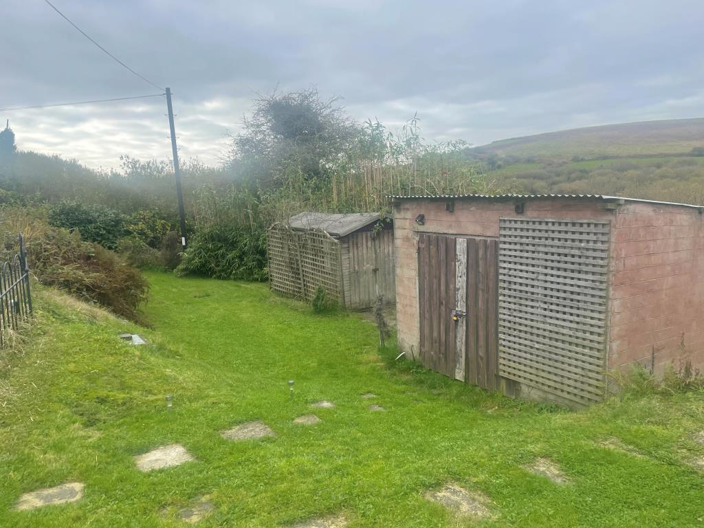 Separate garden space with garden sheds