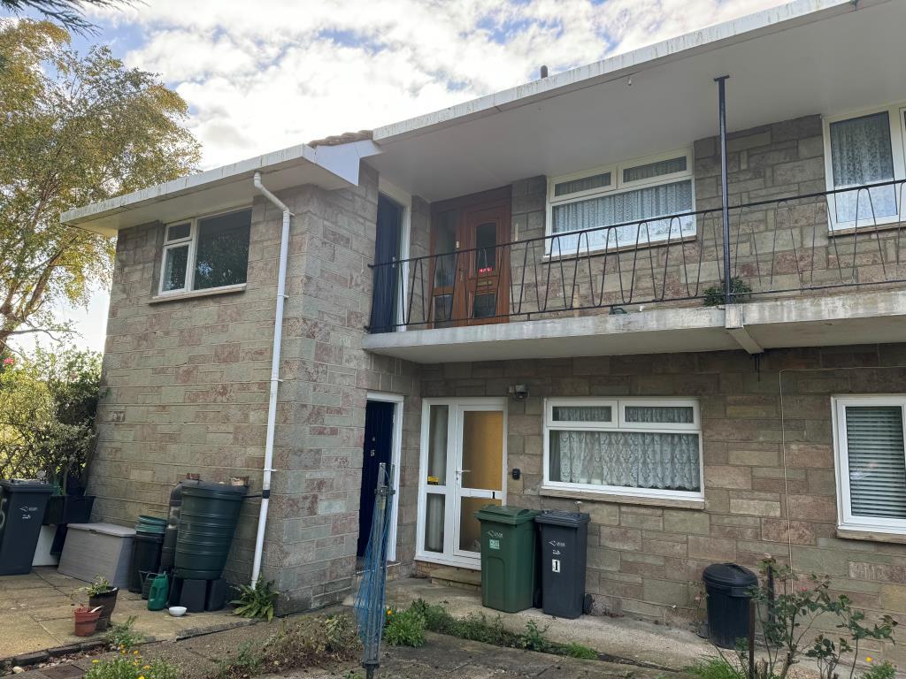 Rear view of building showing entrances to flats