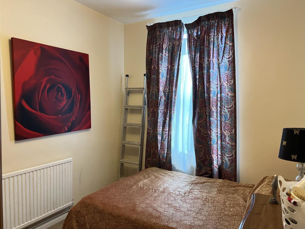 Bedroom with painted magnolia walls