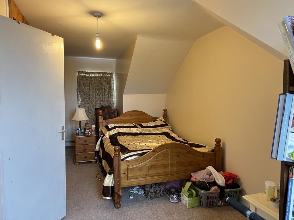 Bedroom on second floor with painted magnolia wall