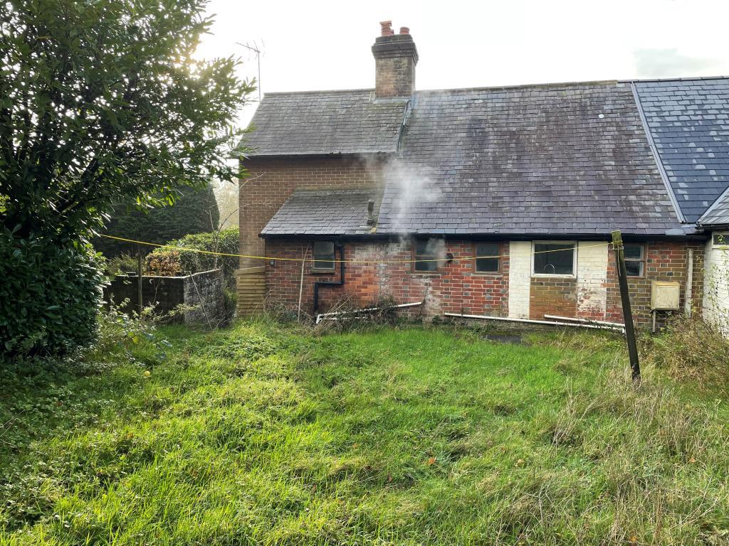 Rear view of house and lawn