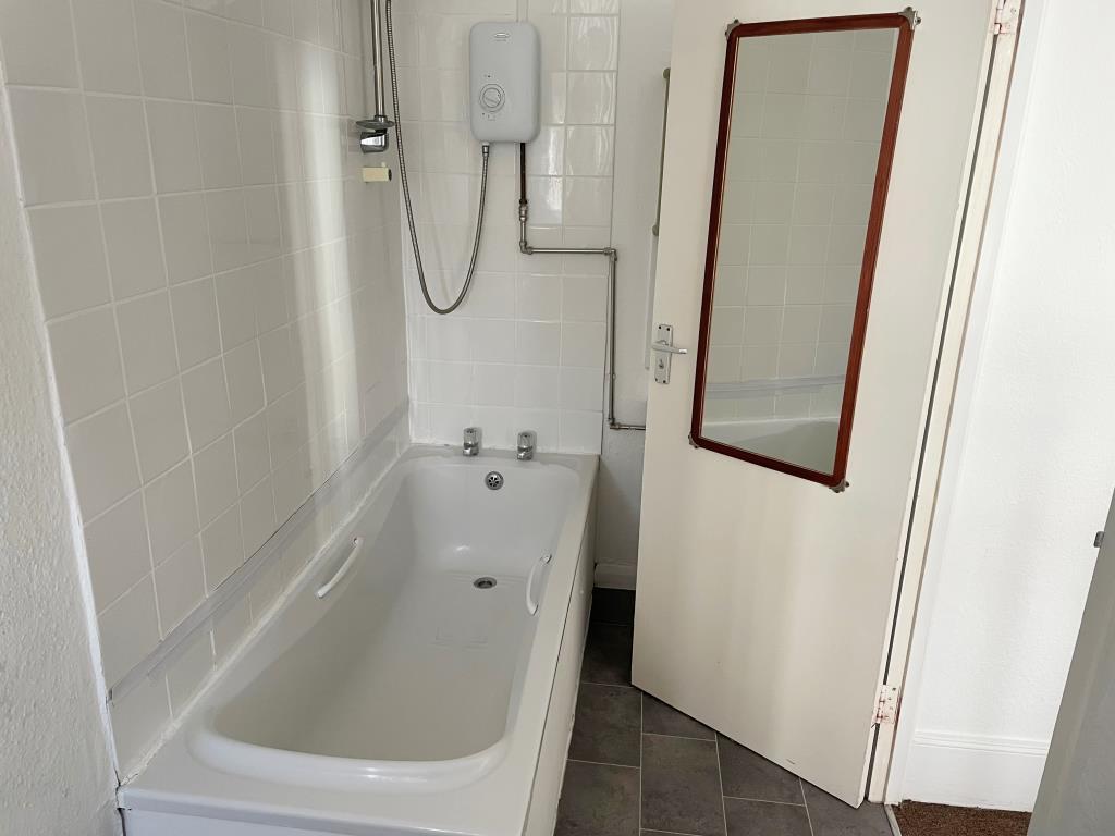 White bathroom suite with fitted shower