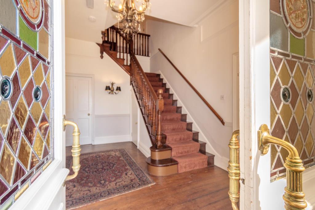 Communal entranceway with stairs to second floor