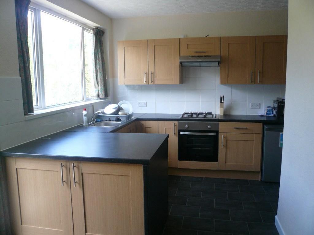 A bright and spacious kitchenette featuring mod...