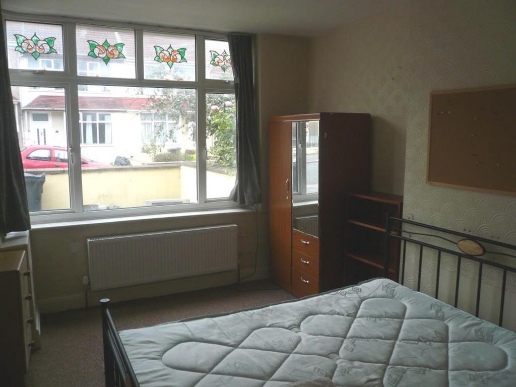 A bright and spacious double bedroom with ample...