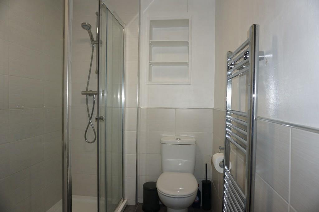 A modern and well maintained bathroom featuring...