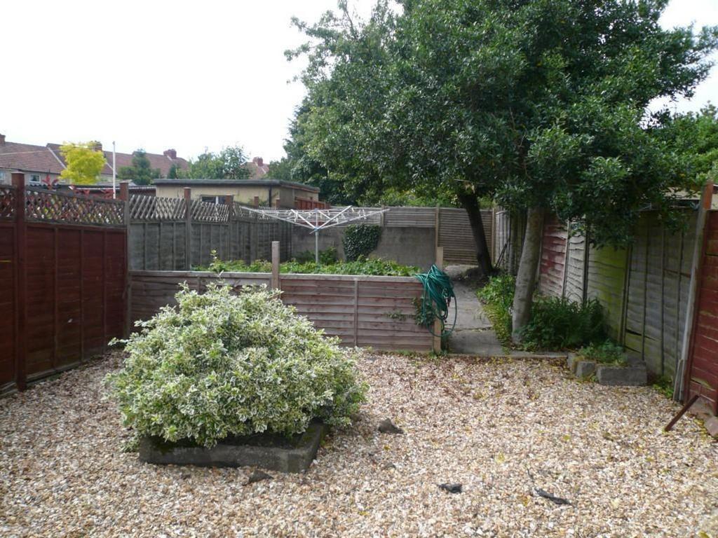 A spacious garden area with well maintained gre...