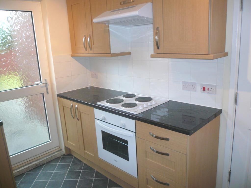 A tidy and well equipped kitchenette with ample...