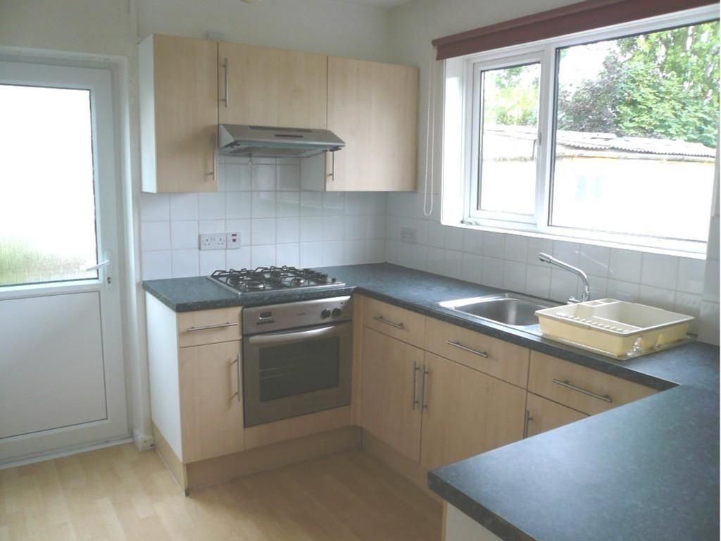 A bright and tidy kitchenette featuring modern ...