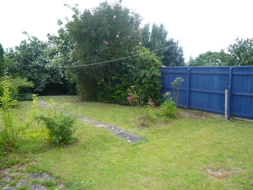 A spacious and inviting garden, perfect for rel...