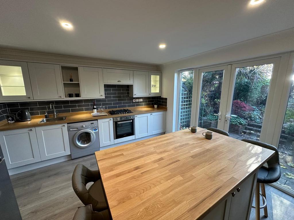 A modern and spacious kitchen with ample natura...