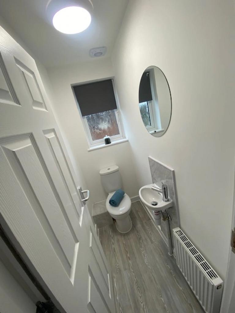 A modern and clean single toilet with stylish d...