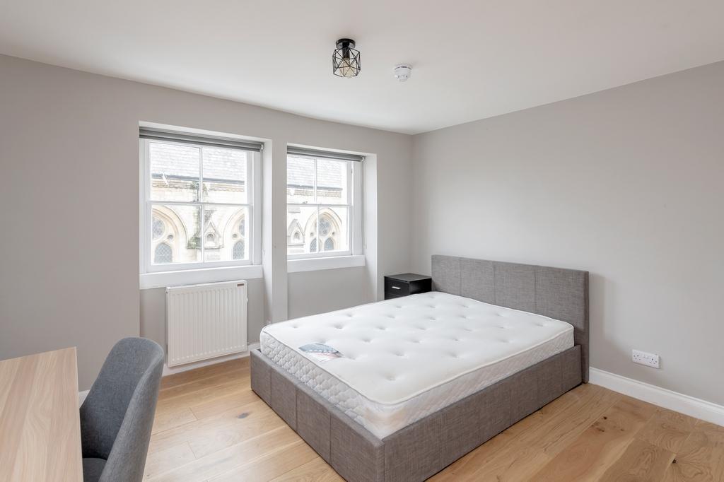 A spacious and bright double bedroom, perfect f...