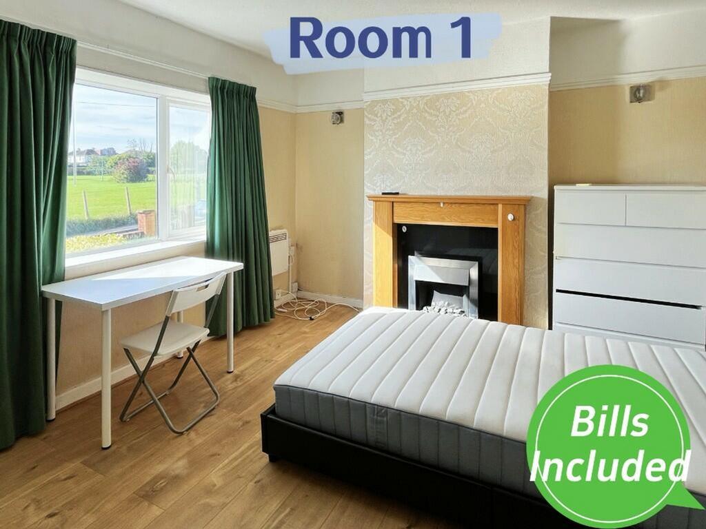 A bright and spacious double bedroom featuring ...