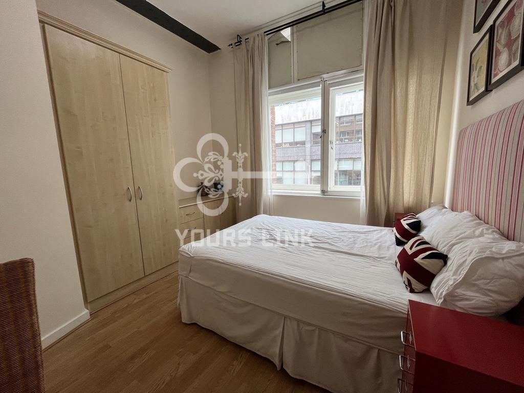 A bright and inviting double bedroom featuring ...