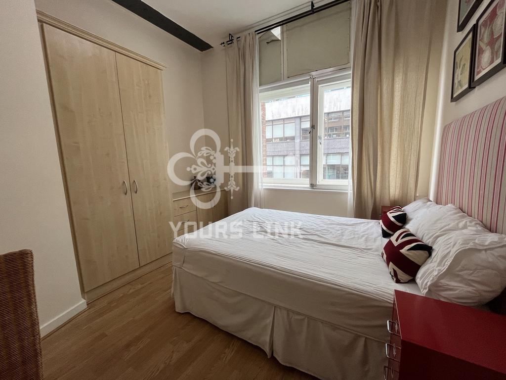 A bright and inviting double bedroom featuring ...