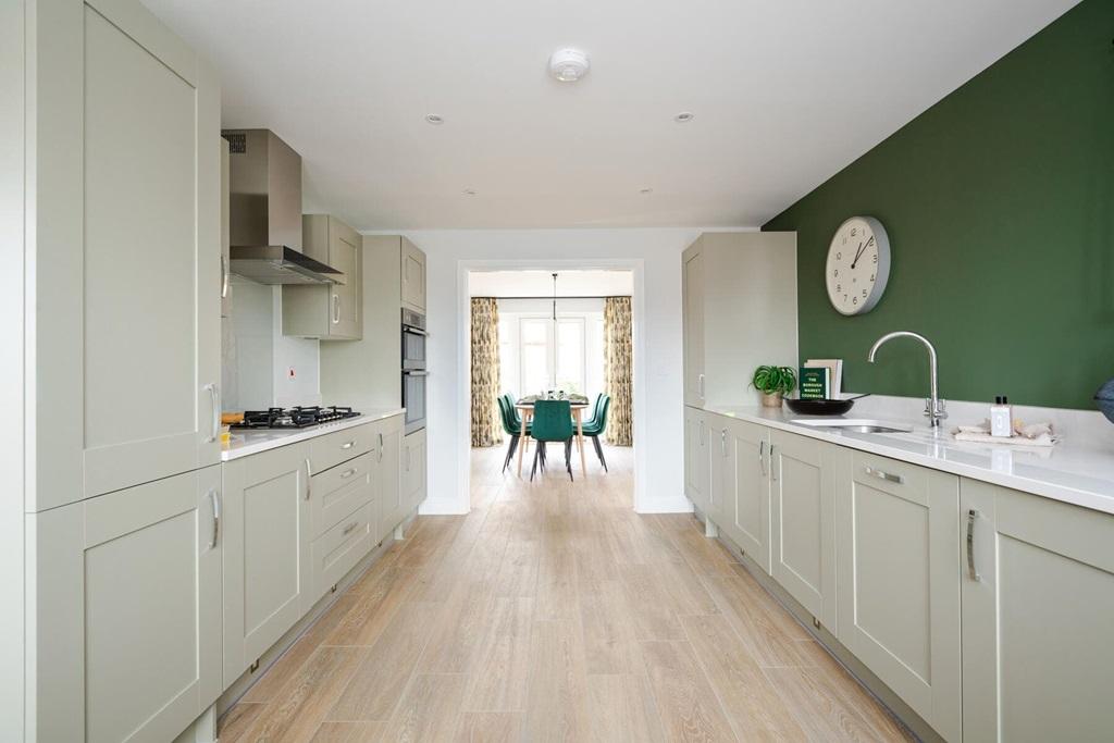 The kitchen leads through to the dining area...