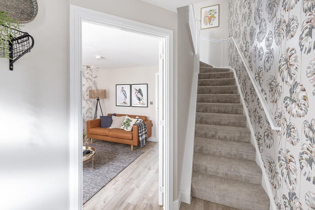 A welcoming hallway leads into the lounge