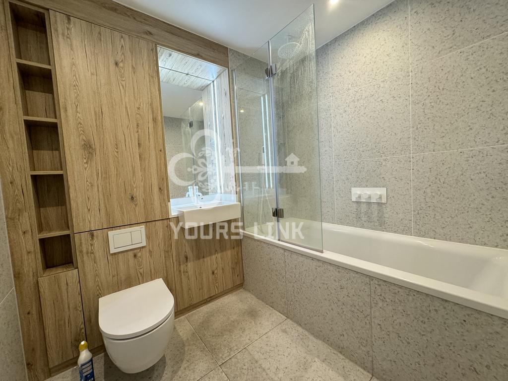 A beautifully designed large bathroom featuring...