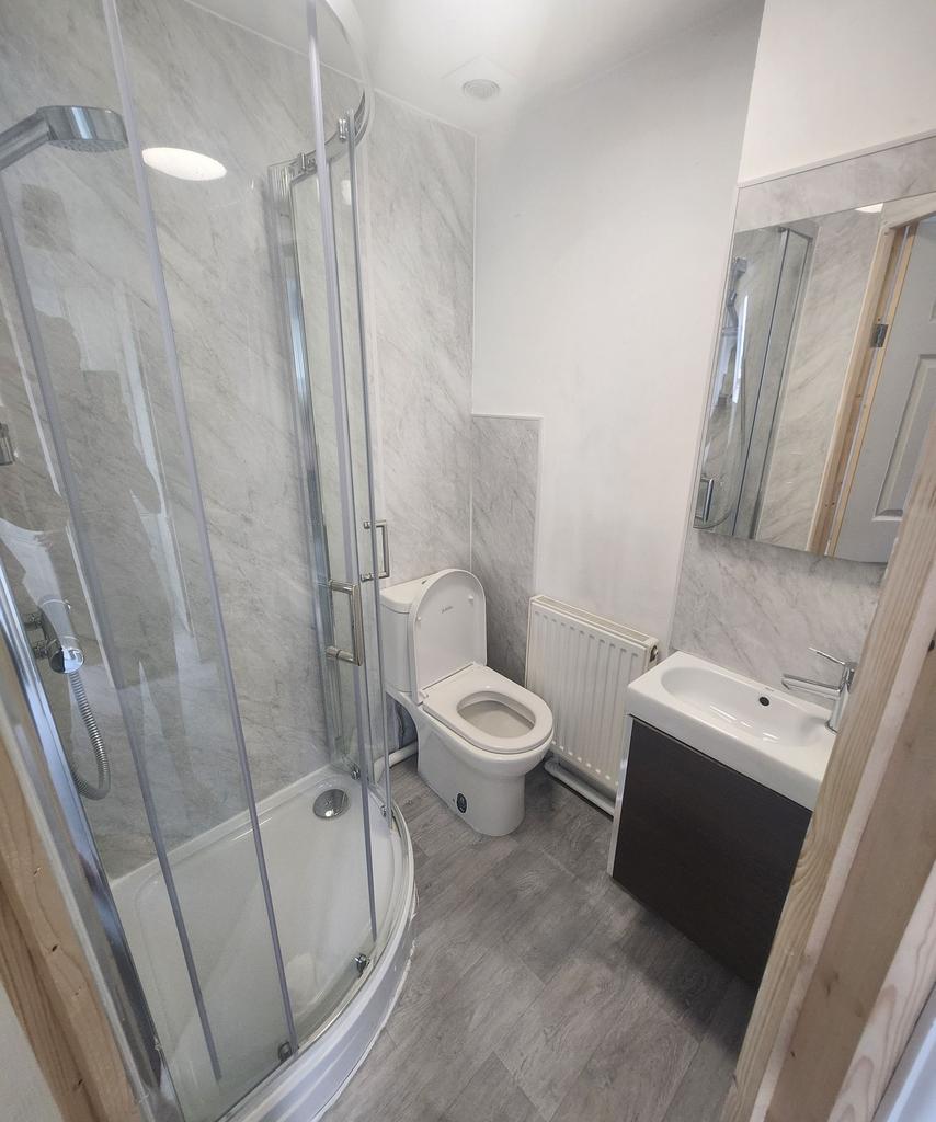 Bright and tidy bathroom featuring a modern cor...