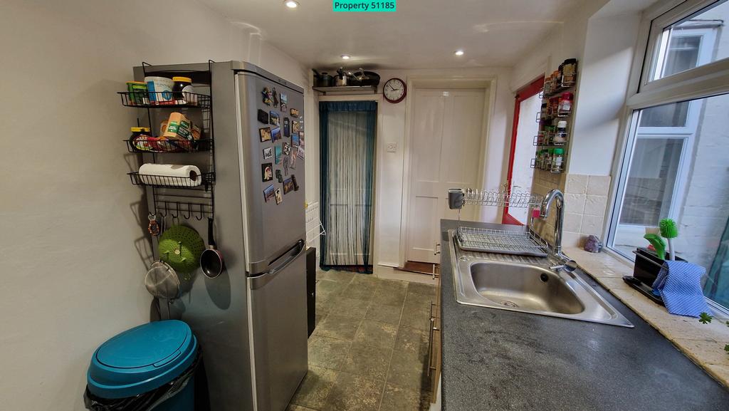 Kitchen, including door to cellar stairs