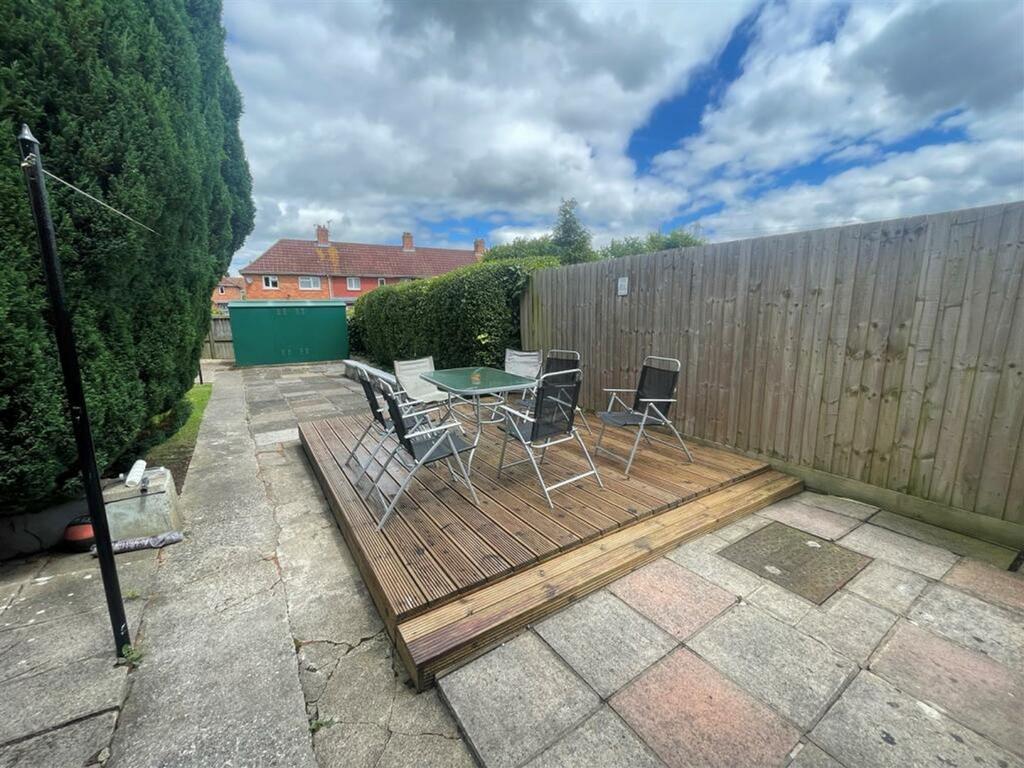 A spacious and well-maintained garden area perf...