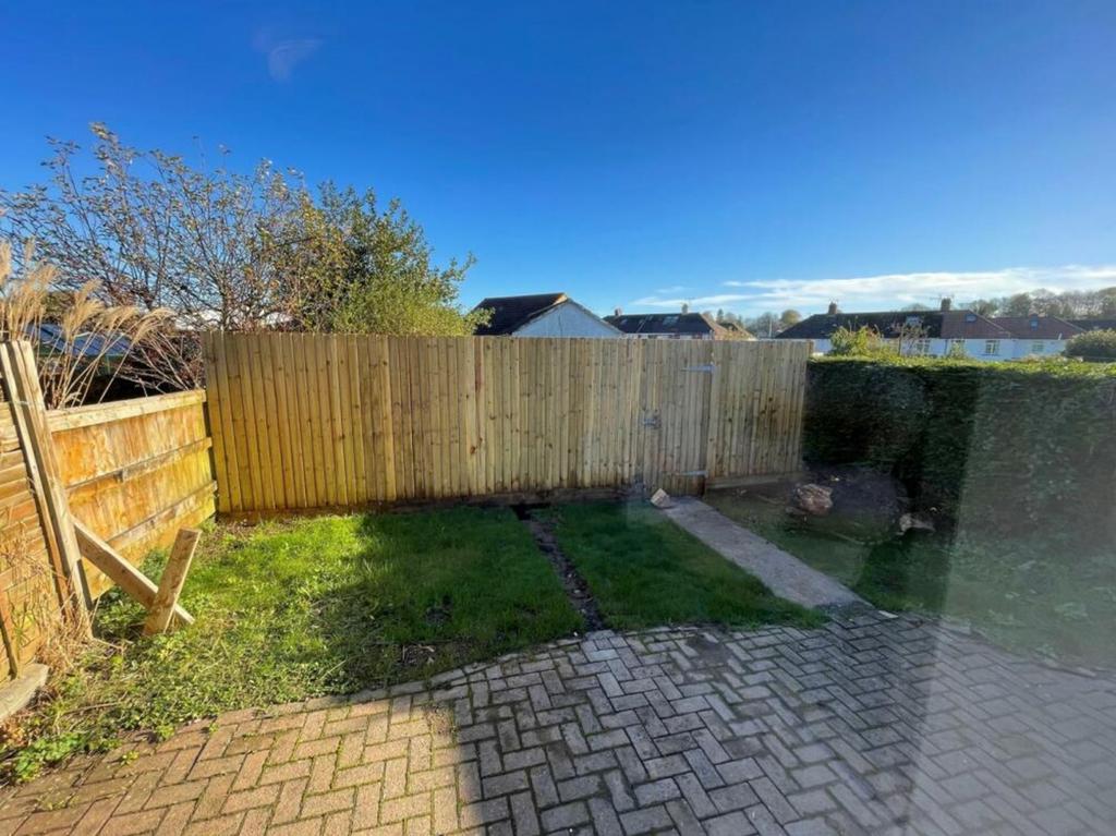 A spacious and well maintained garden bathed in...