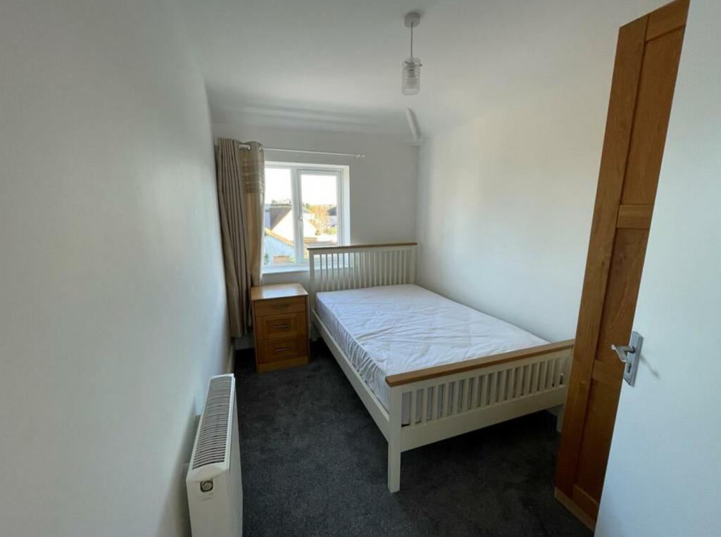 A bright and spacious double bedroom, perfect f...