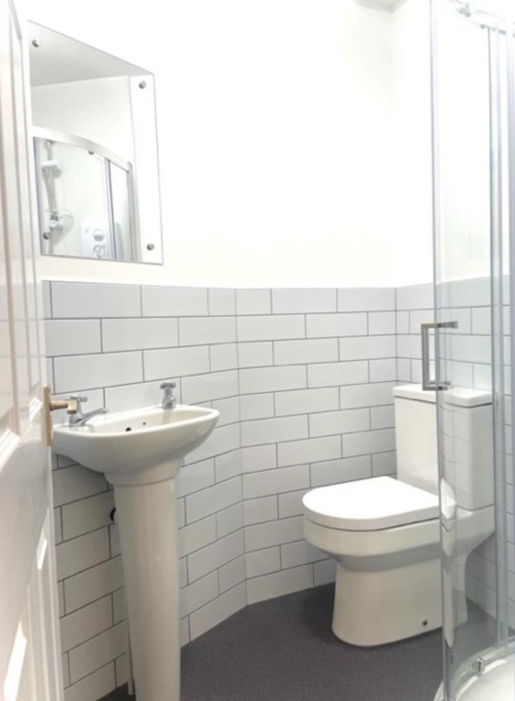 A modern and clean bathroom featuring a stylish...
